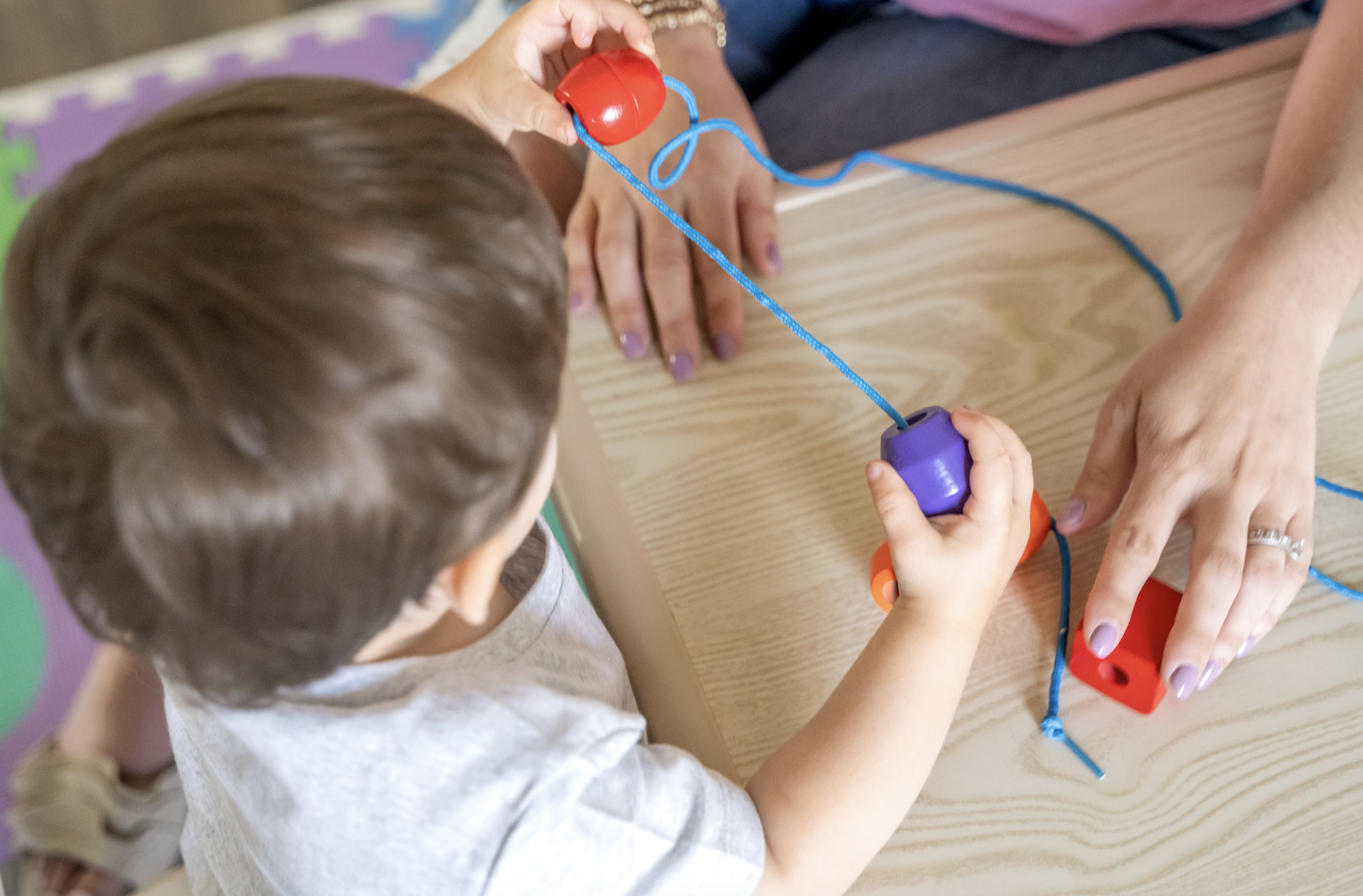Child with branch mobile craft