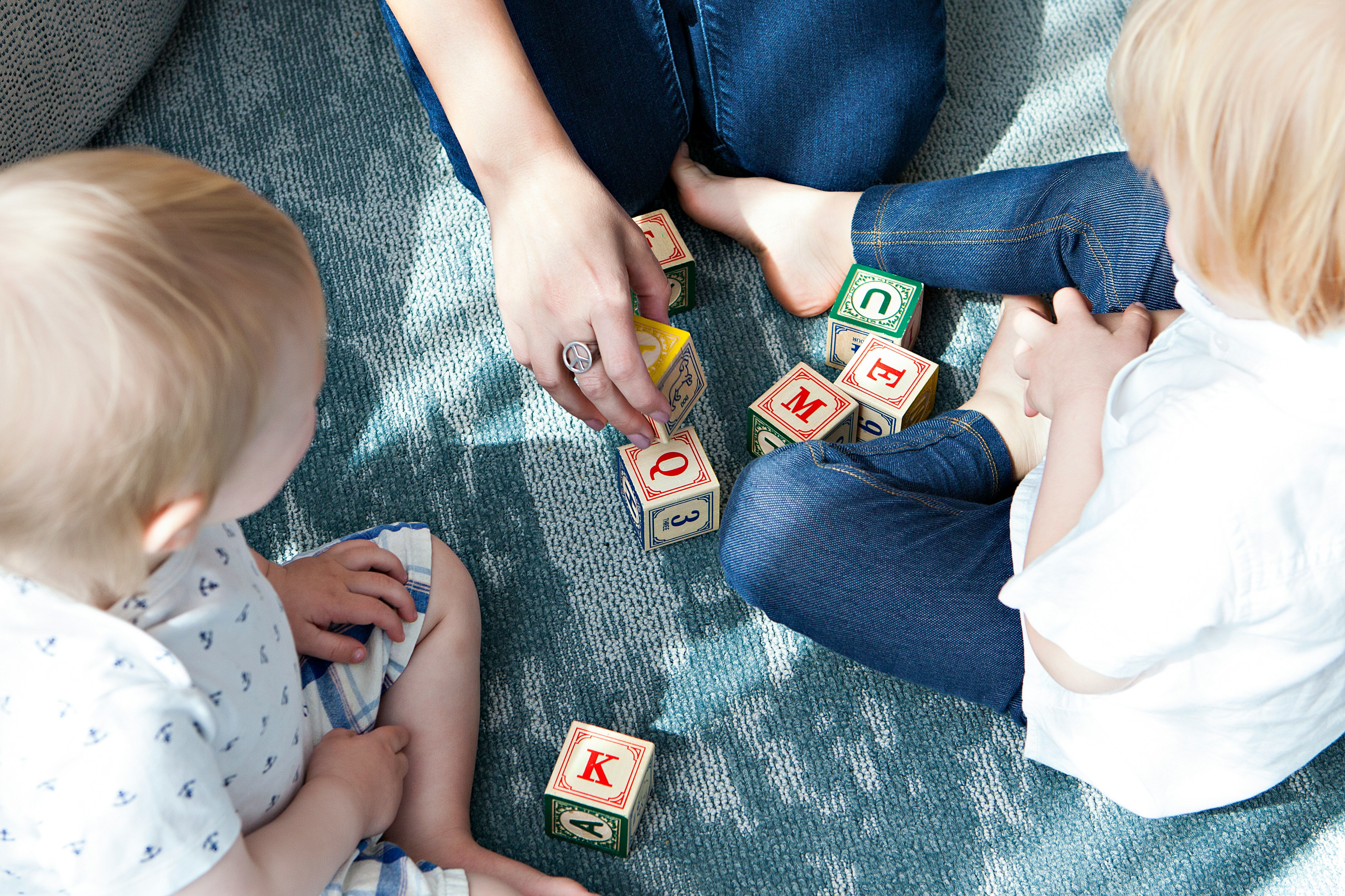 Child playing with wooden Montessori toys